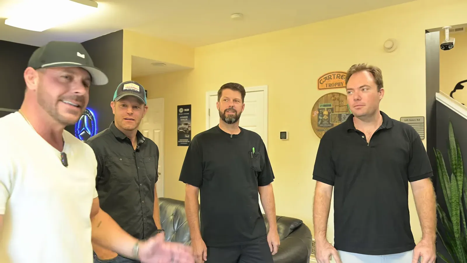Cameron Davis greets Grant Brewer, Dave Codrea and the crew in the DC MotorWerks lobby