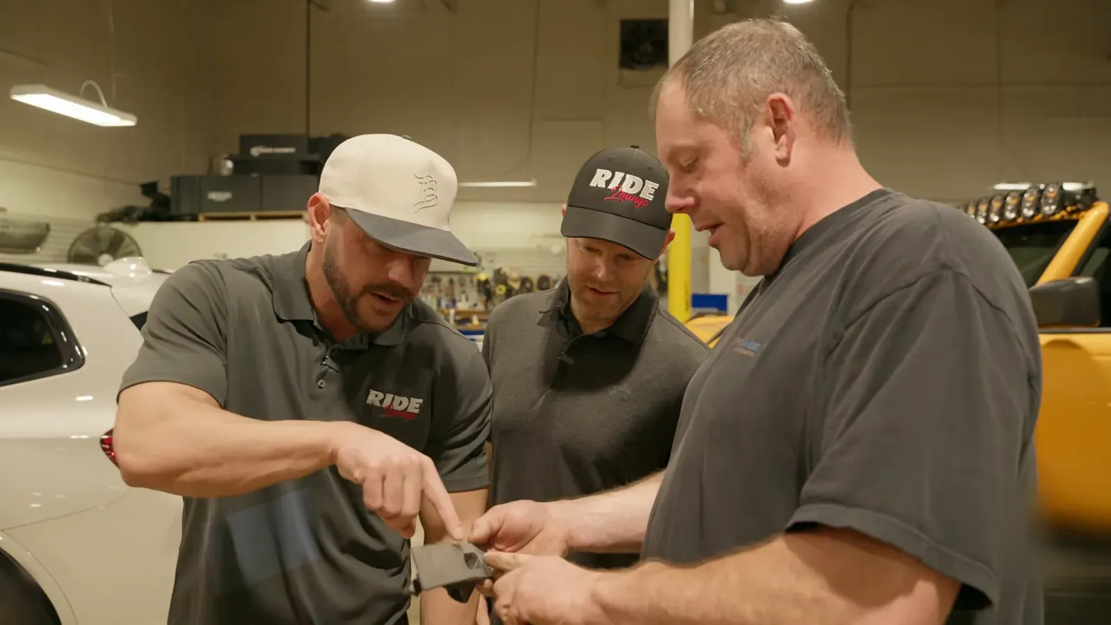 The Car Tunes Atlanta team looks over a radar sensor install