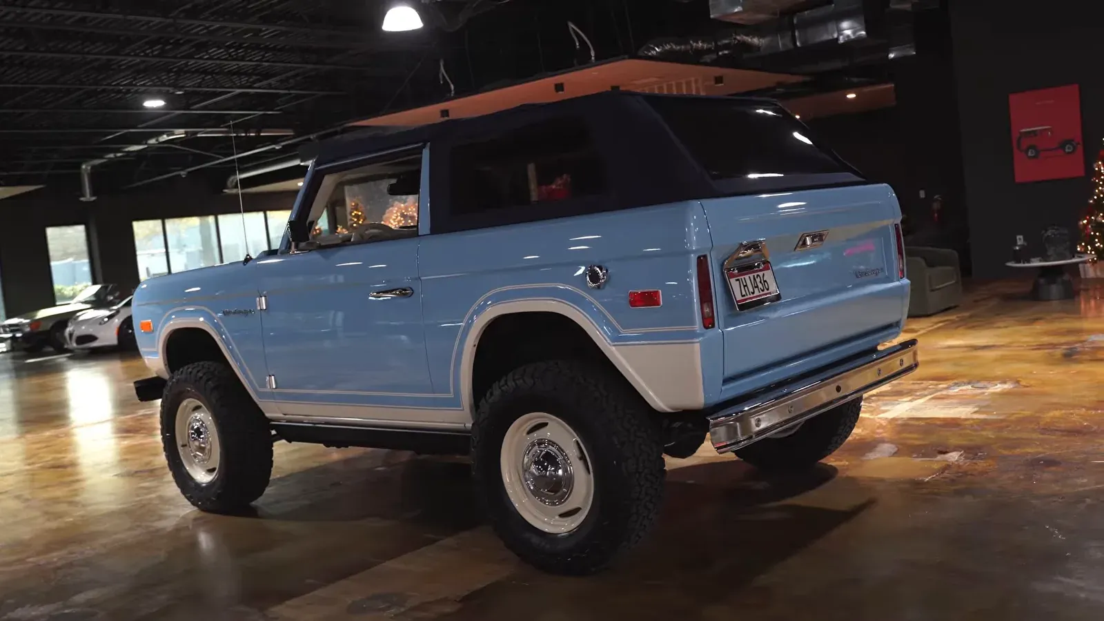 The Arcadian Blue Vintage Modern demo truck on the lounge floor, seen from the rear quarter