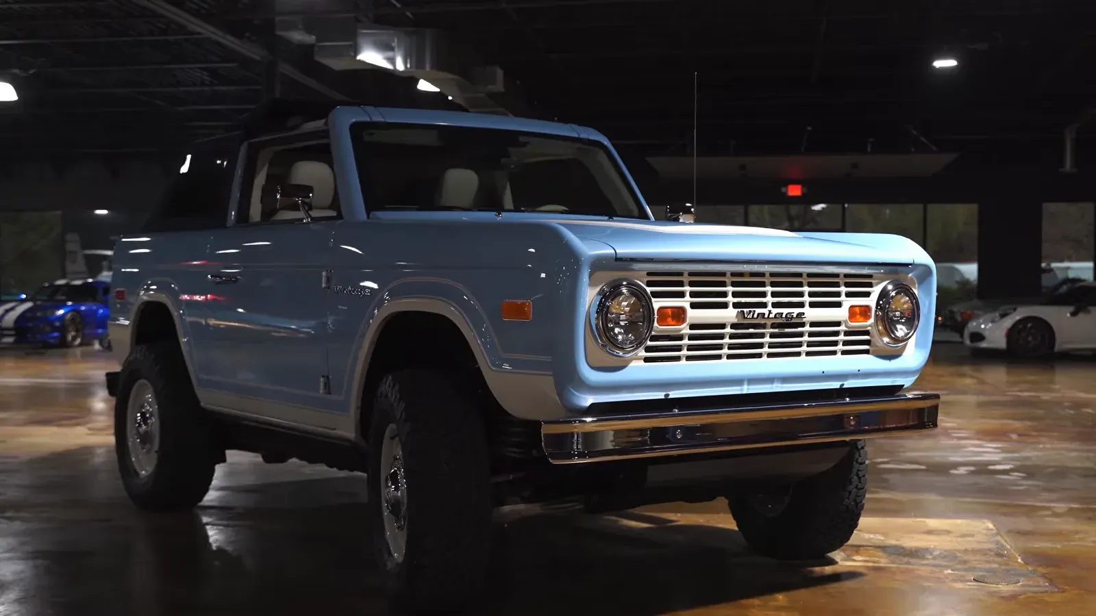 The Arcadian Blue Vintage Modern demo truck on the lounge floor, seen from the front quarter