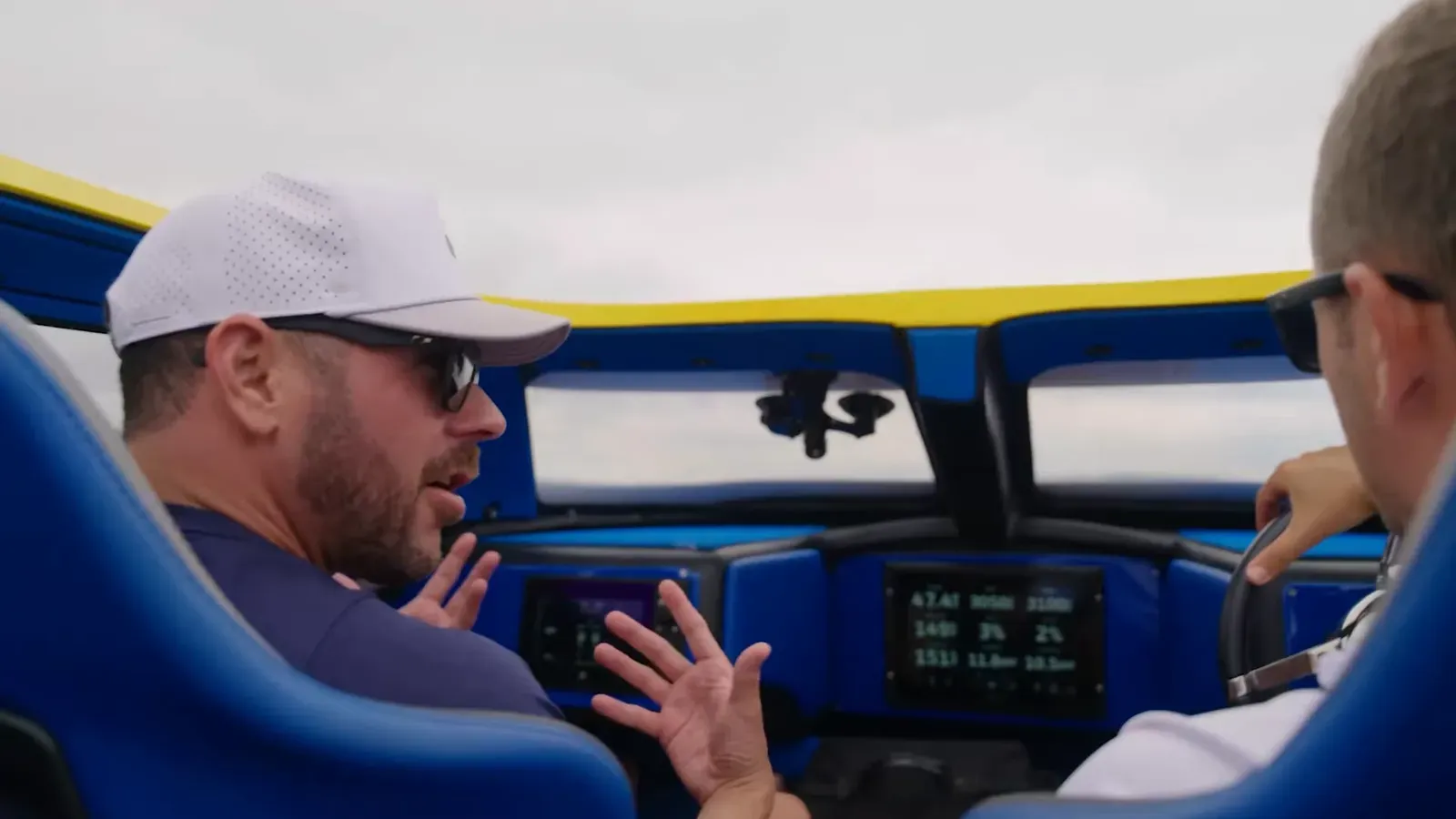 Parker Smith at the helm of the boat on Lake Lanier