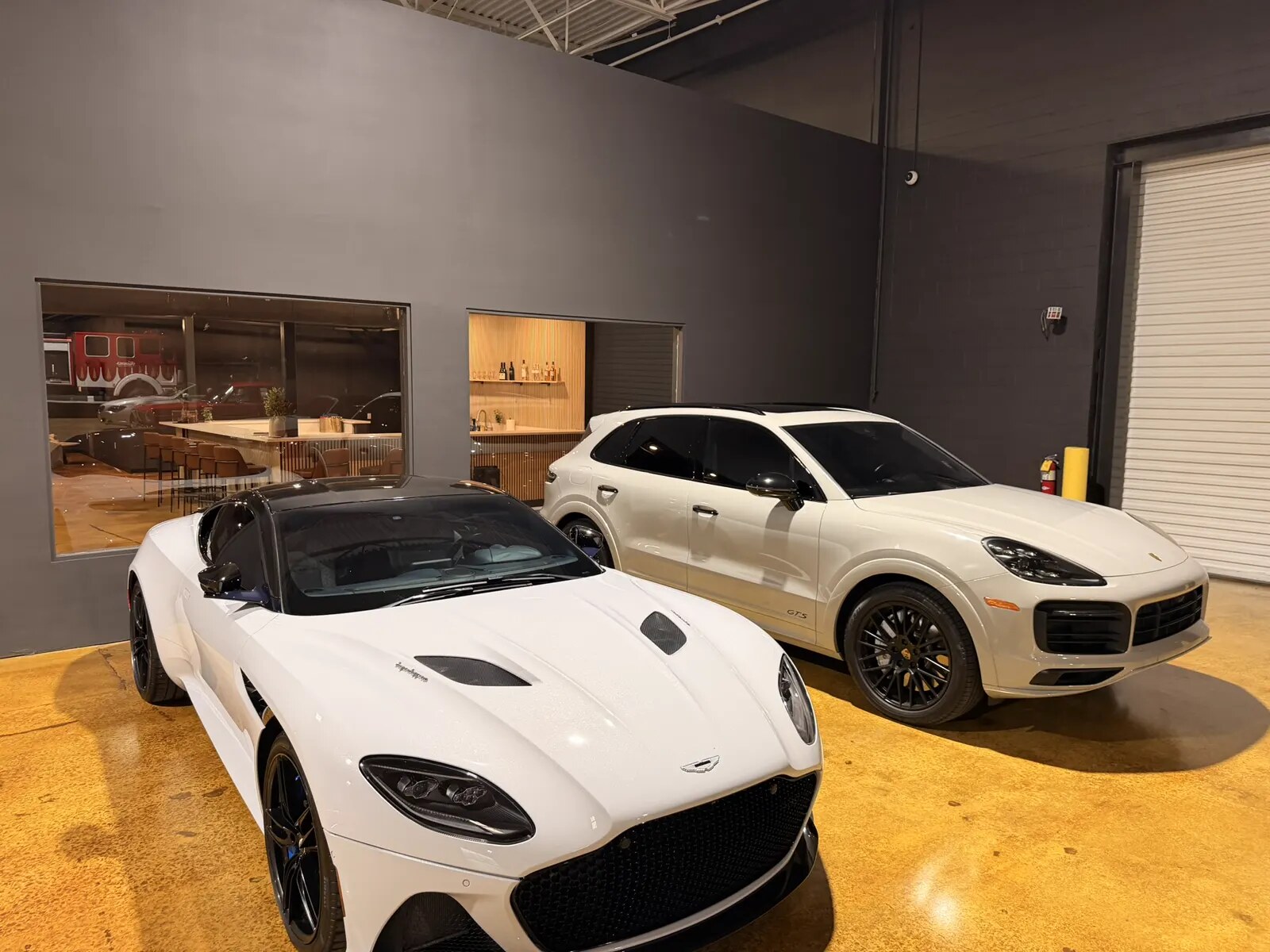 An Aston Martin DBS and a Porsche Cayenne in Atlanta storage