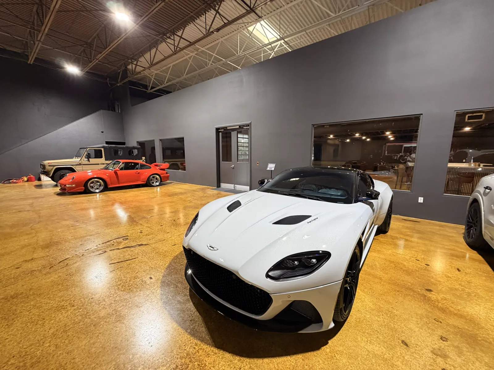 A white Aston Martin on the Atlanta storage floor