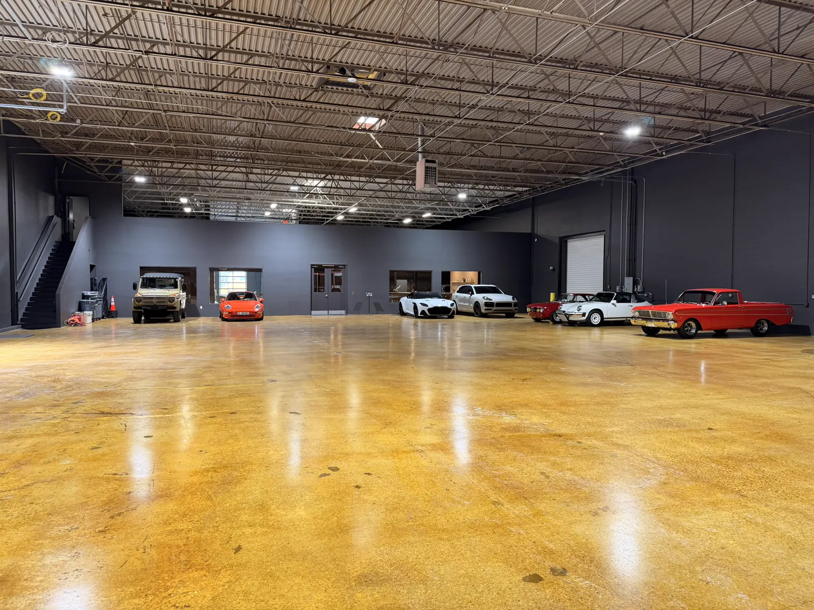 The Atlanta storage floor with members' cars parked along the walls