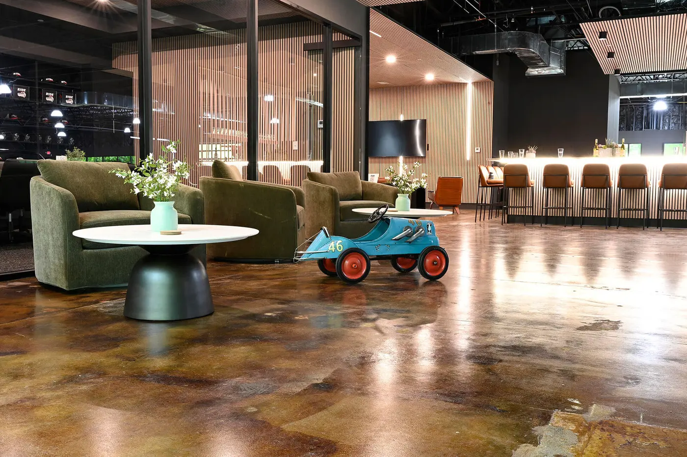 Lounge seating with a vintage pedal car on the floor