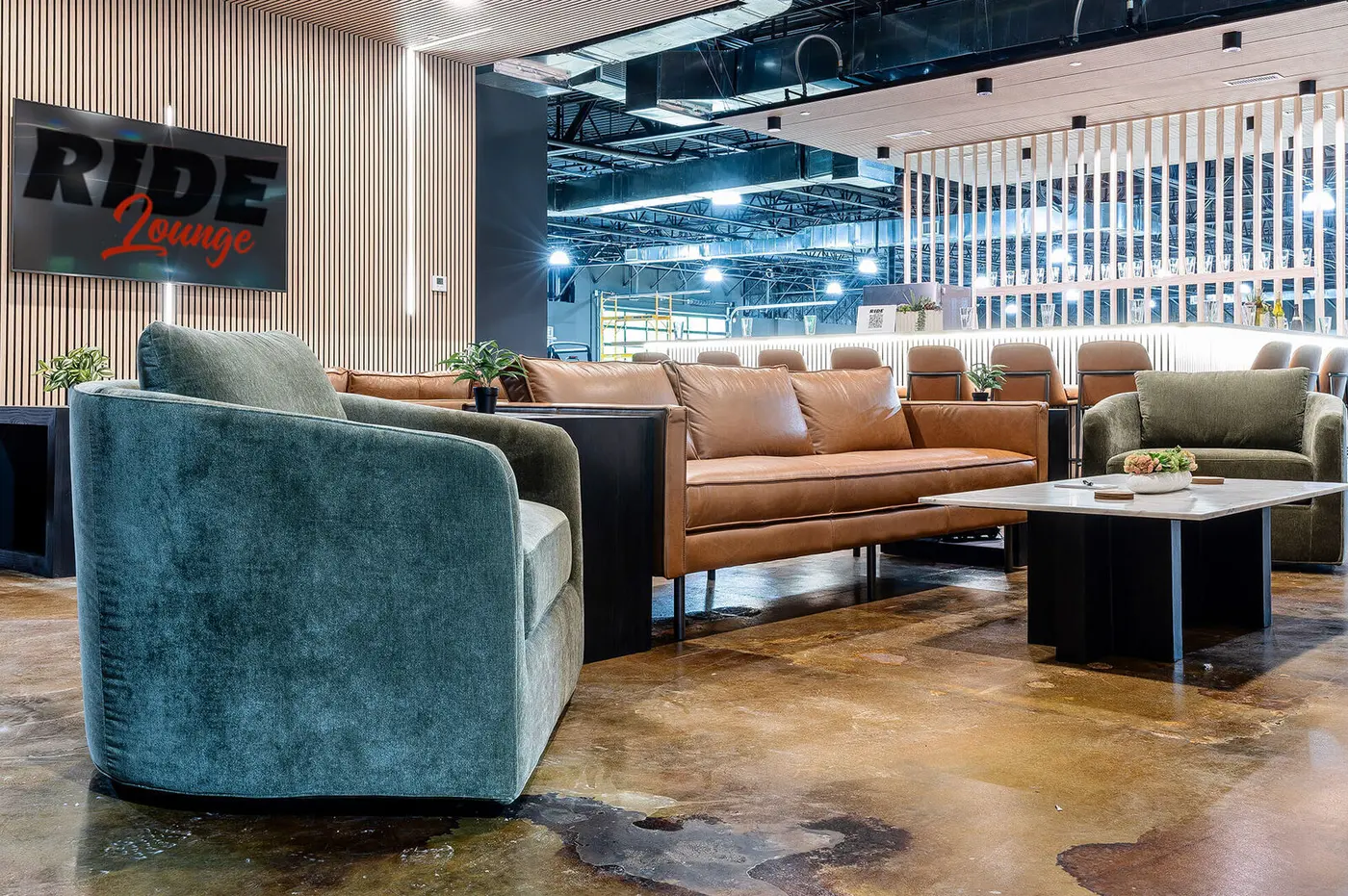 Members' lounge seating under the Ride Lounge sign