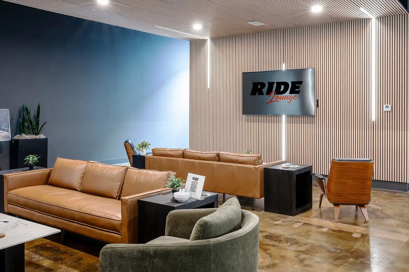 Leather sofas under the Ride Lounge sign